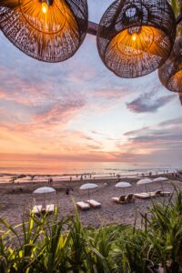 Image of beach and chairs in Bali to convey the best Bali travel guide for digital nomads - Odyssey App