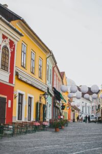 Image of Szentendre cobblestone street to convey the need for a good Budapest Travel Guide - Odyssey App